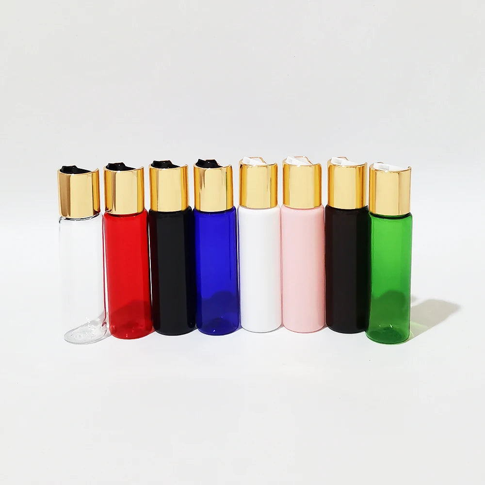 Eight bottle colors with gold-tone disc-top caps and black or white inserts