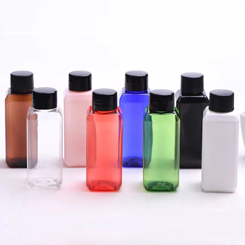 Empty square bottles in several colors with black screw caps