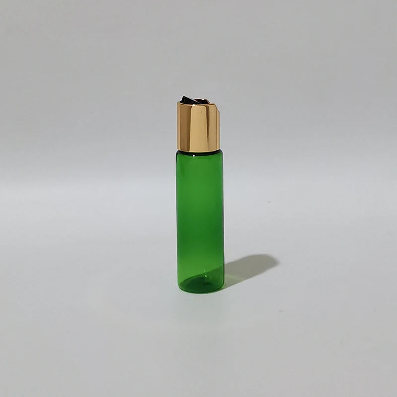 Green PET bottle with gold-tone disc-top cap and black insert, green-1