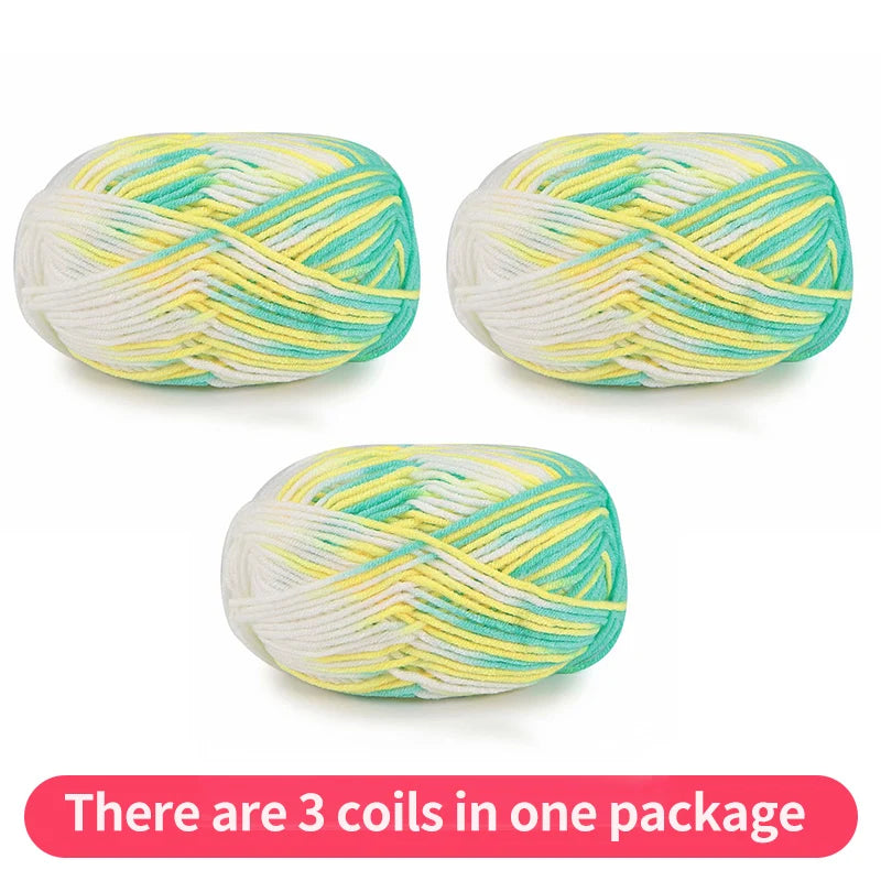 Three variegated yarn skeins in turquoise, yellow and white, shown as one package.