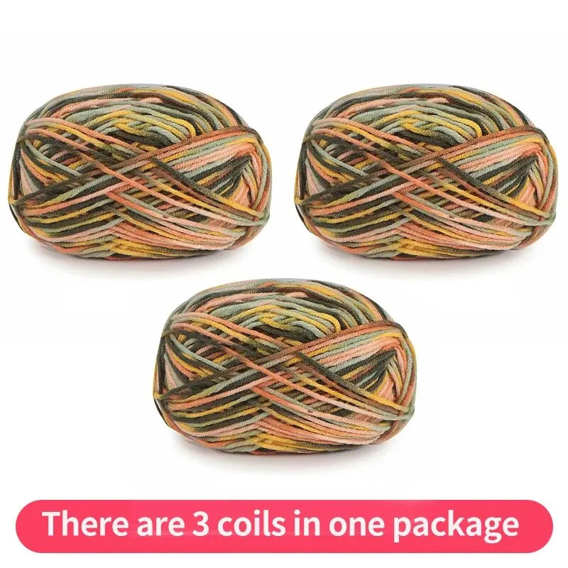 Three variegated yarn skeins in olive, peach, brown and yellow, shown as one package.
