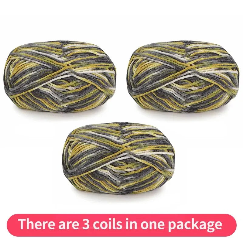 Three variegated yarn skeins in olive, charcoal, yellow and white, shown as one package.