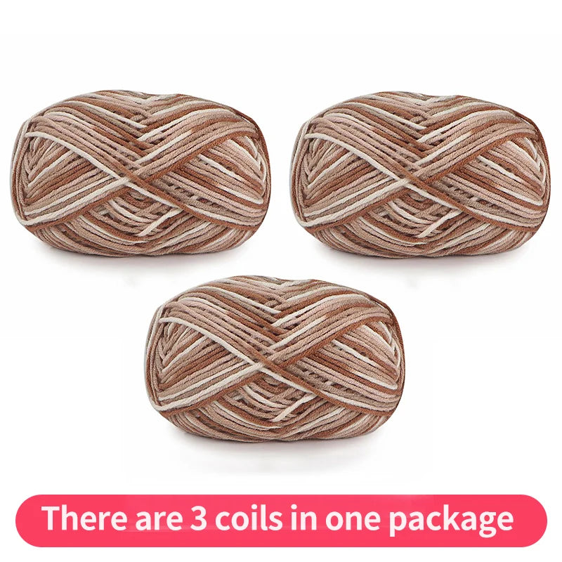 Three beige, cream and brown variegated yarn skeins, shown as one package.