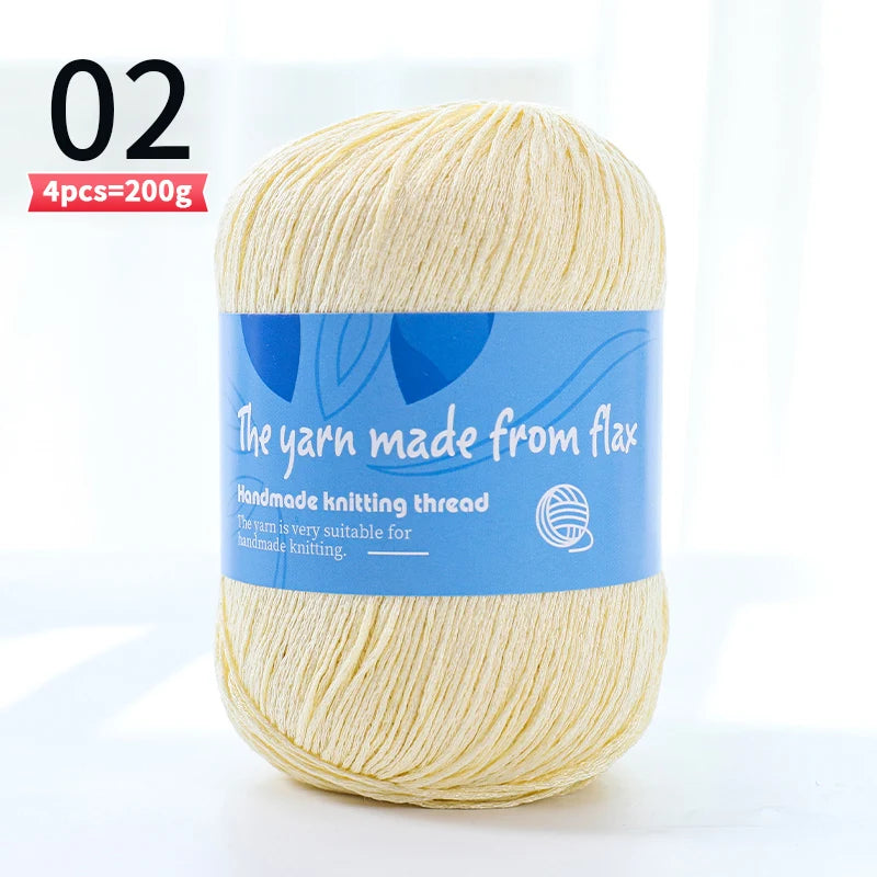 Pale cream linen lace yarn skein, color code 02, with a blue flax label and four-skein pack marking.