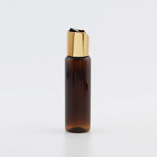 Brown PET bottle with gold-tone disc-top cap and black insert, brown-1