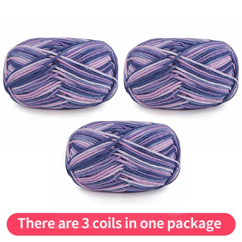 Three variegated yarn skeins in navy, lavender and pink, shown as one package.