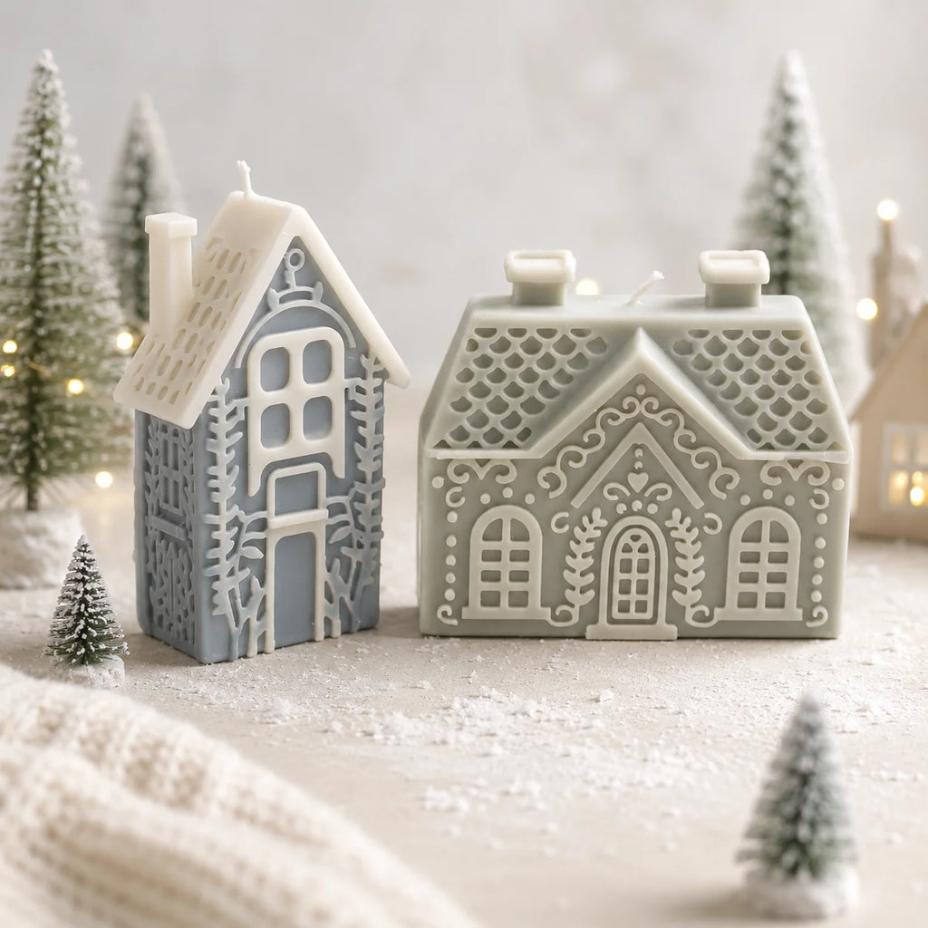Tall narrow blue-gray house and wide green cottage example candles with contrasting ivory relief details