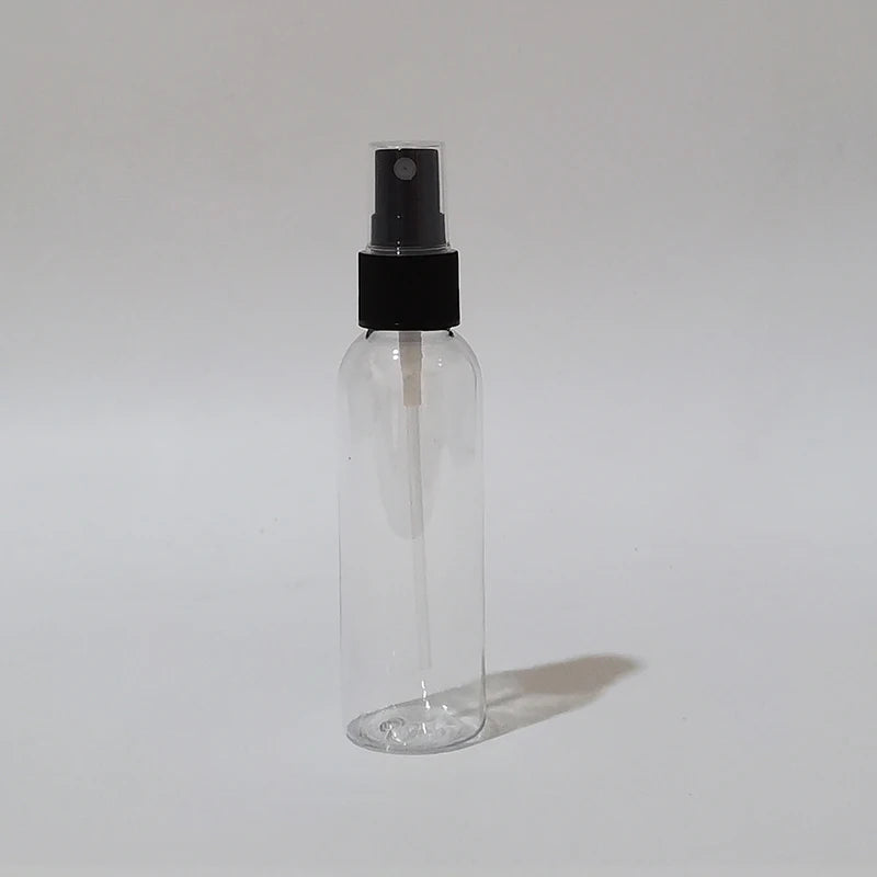 Clear round spray bottle with black sprayer, dip tube and clear protective cap