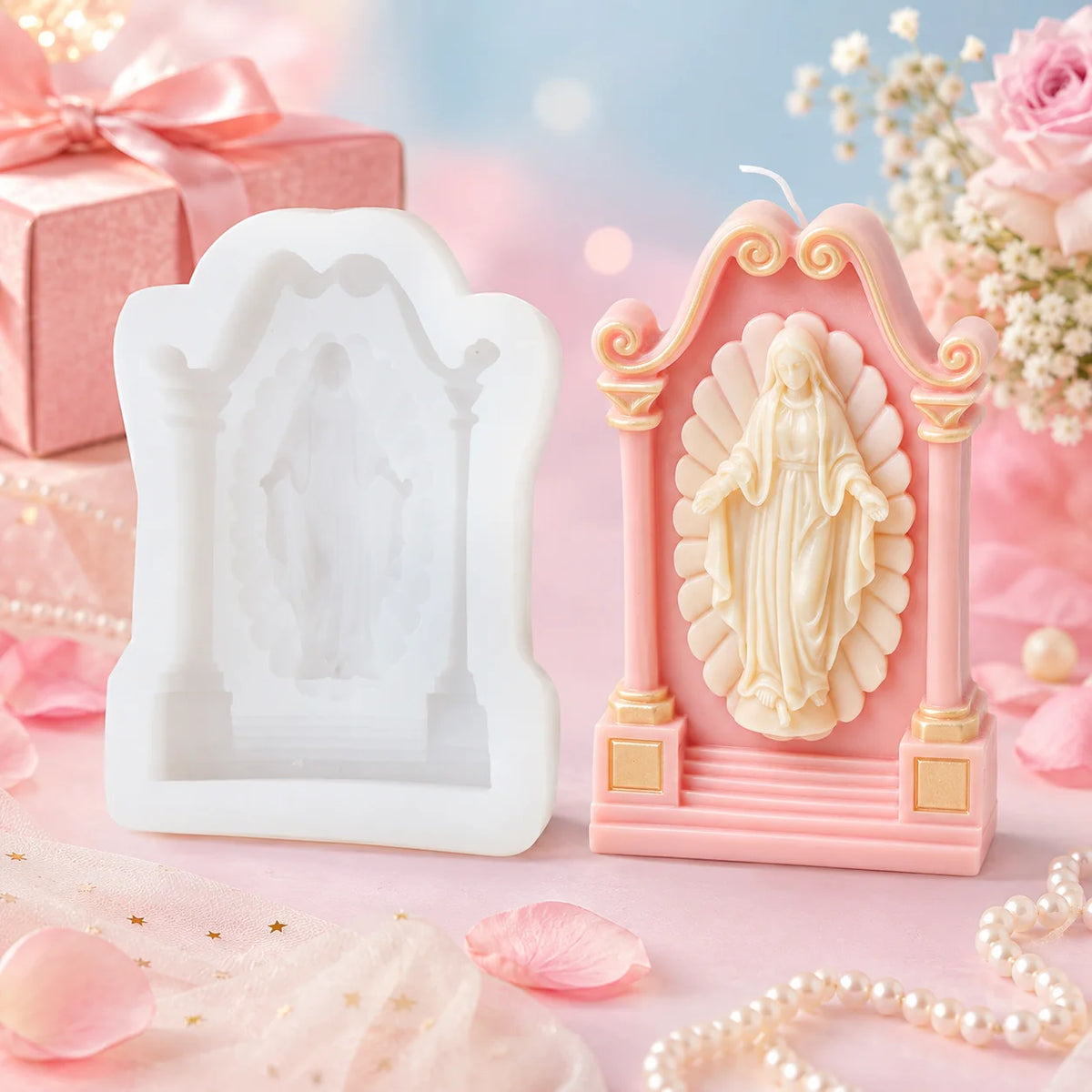 White shrine mold beside a pink example casting with an open-armed standing religious figure