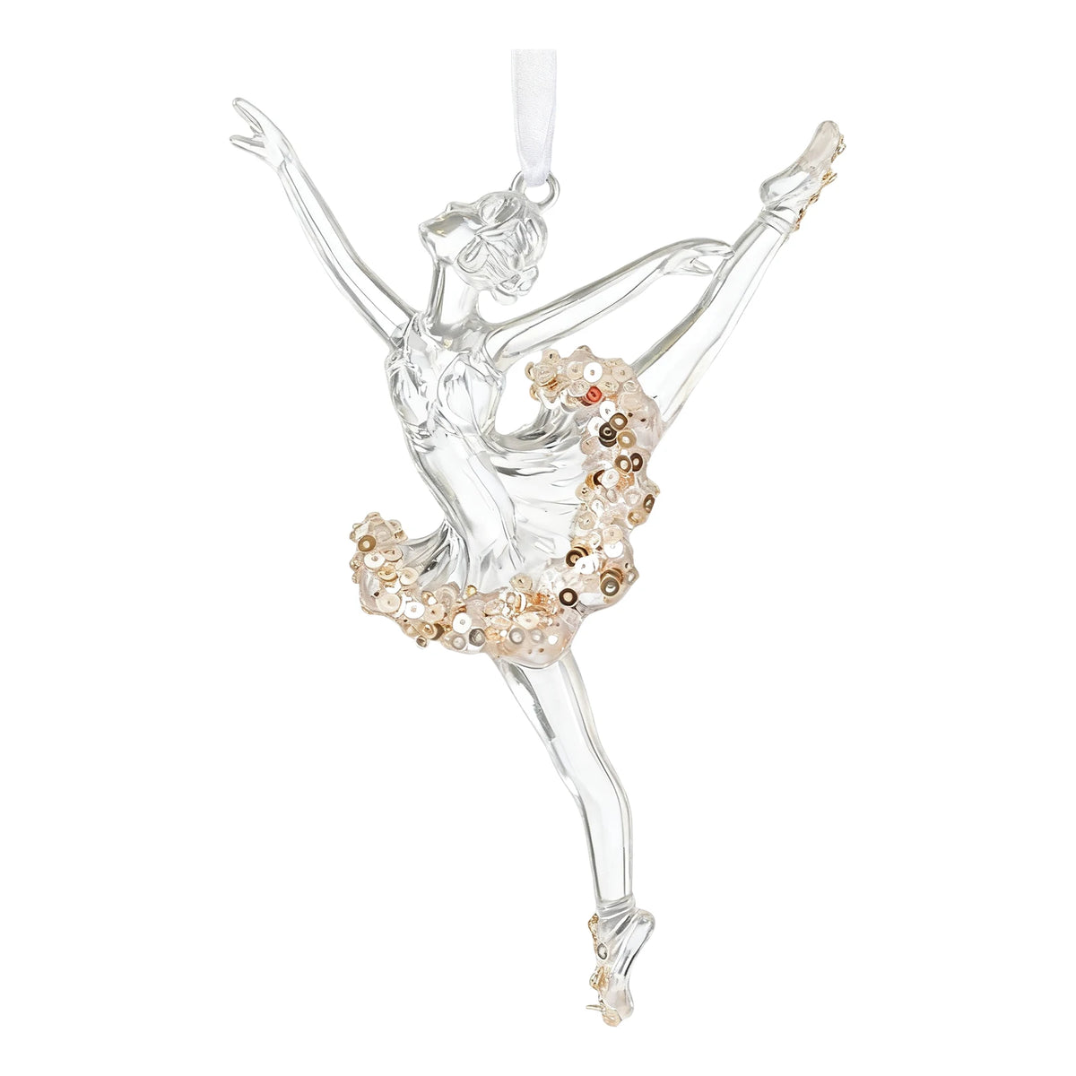 A clear glass ballerina ornament depicting a graceful dance pose, embellished with gold and beige sequins on the tutu, with a white hanging ribbon at the top, set against a plain white background.