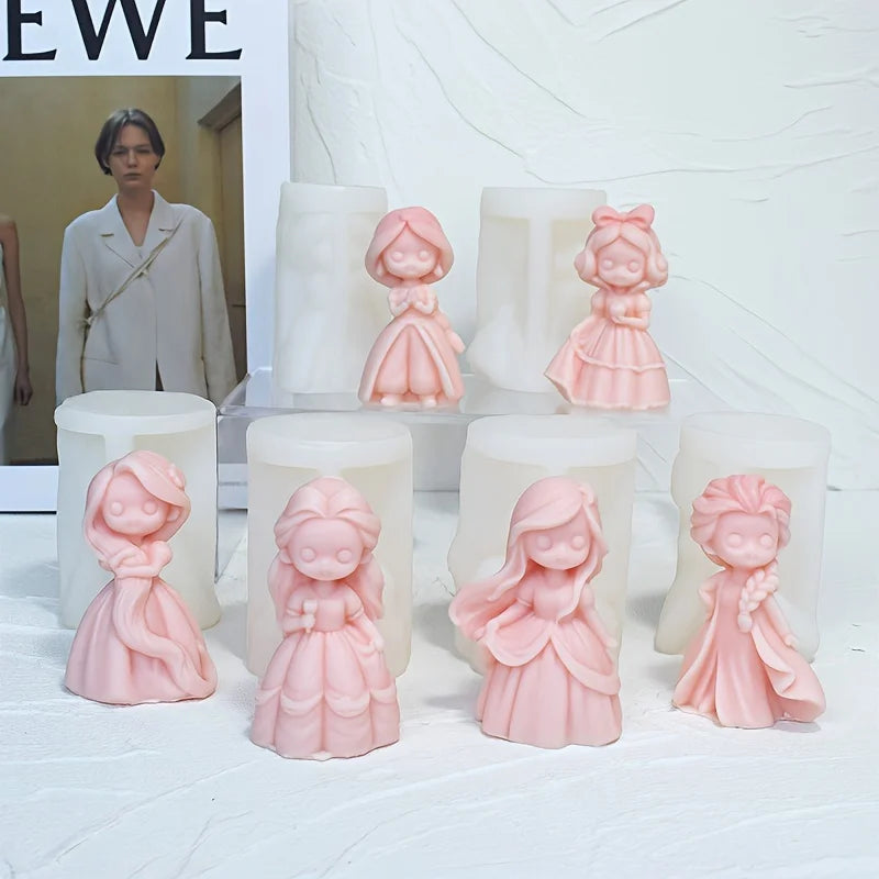 Six pink princess doll casting examples in front of white silicone molds on a stepped display