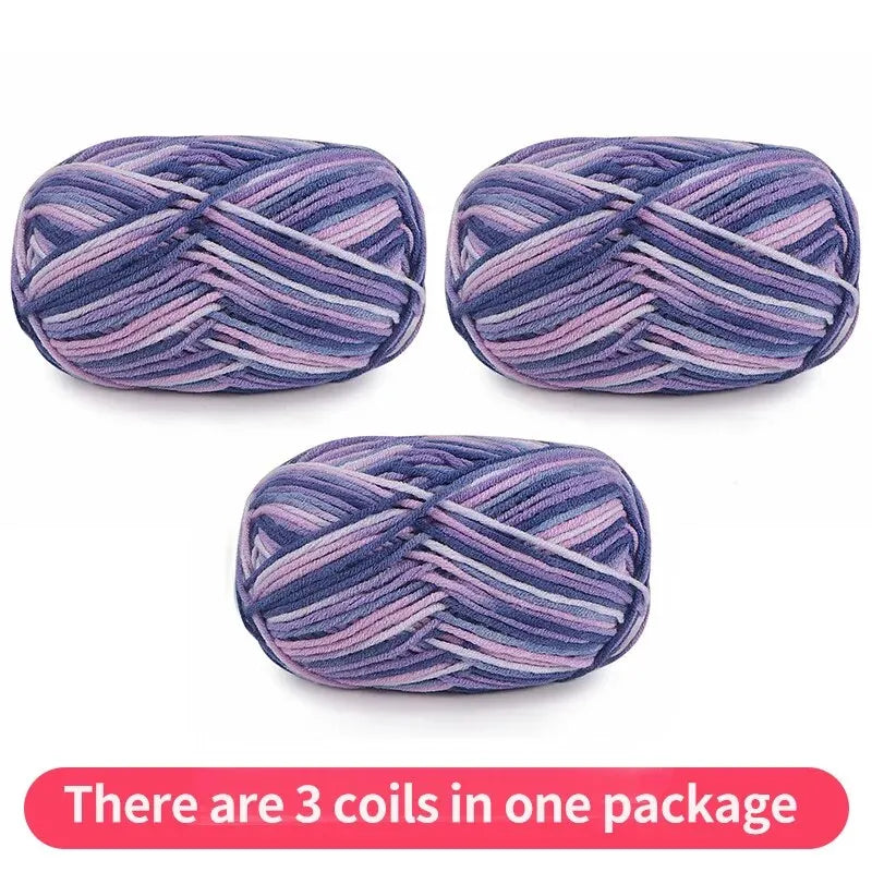 Three variegated yarn skeins in navy, lavender and pink, shown as one package.
