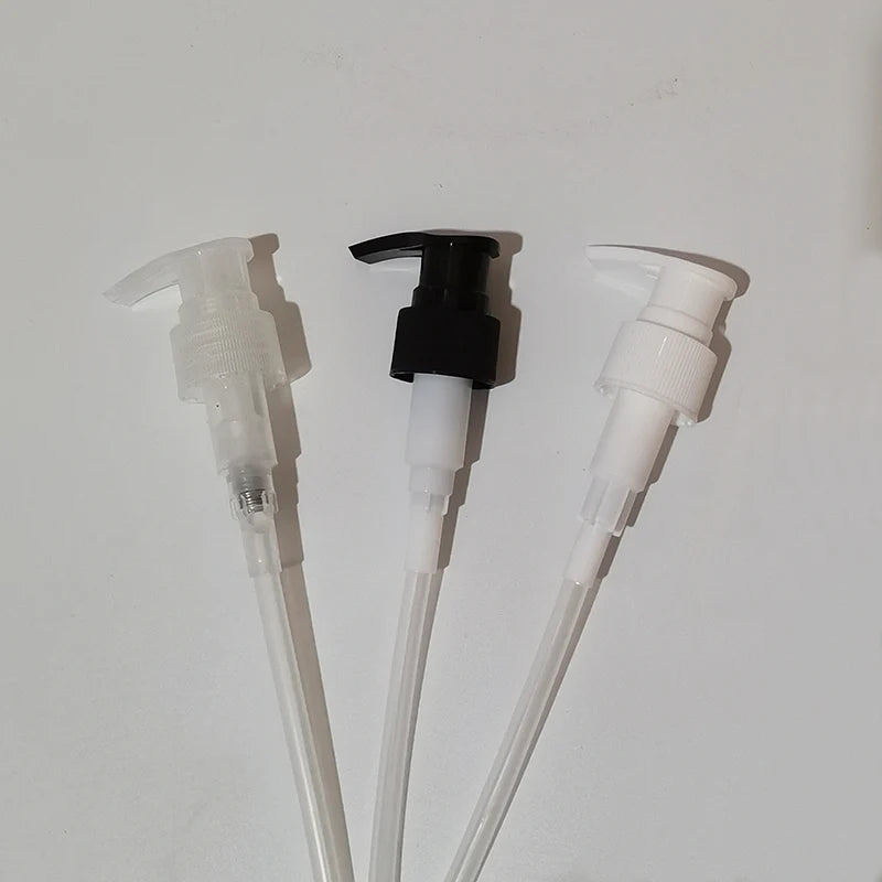 Clear, black and white lotion pump heads with dip tubes