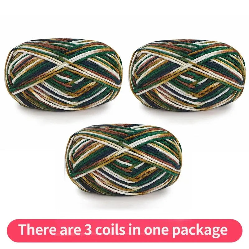 Three variegated yarn skeins in dark green, brown, gold and white, shown as one package.