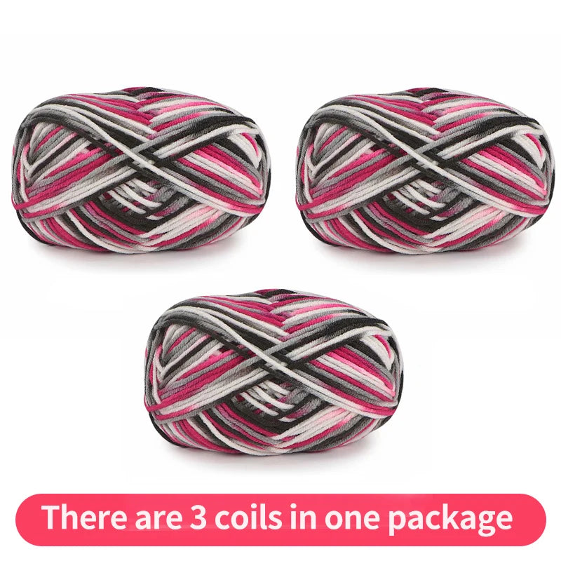 Three pink, black, gray and white variegated yarn skeins, shown as one package.