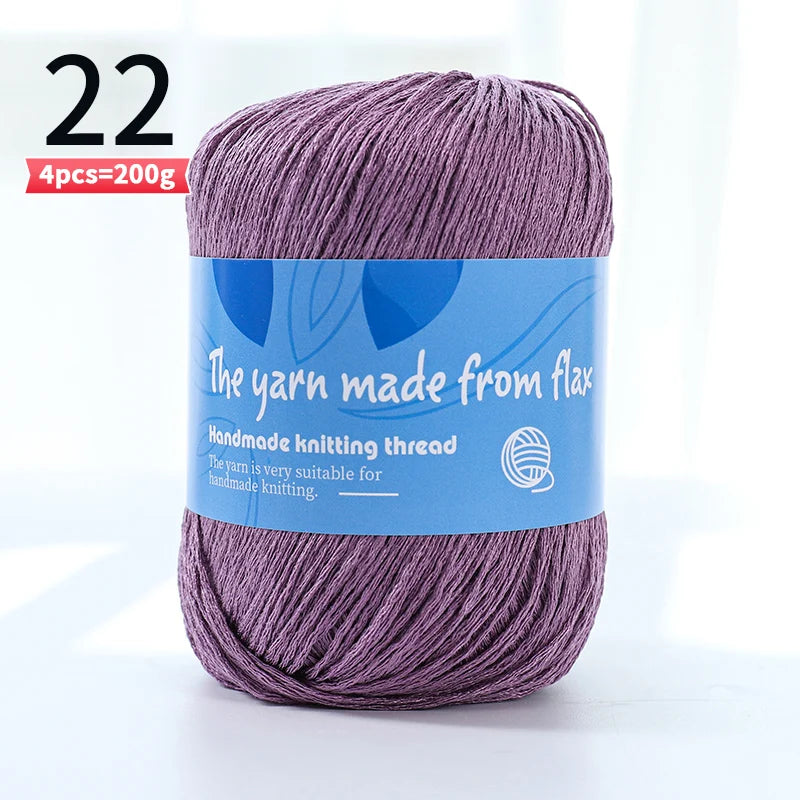 Purple linen lace yarn skein, color code 22, with a blue flax label and four-skein pack marking.