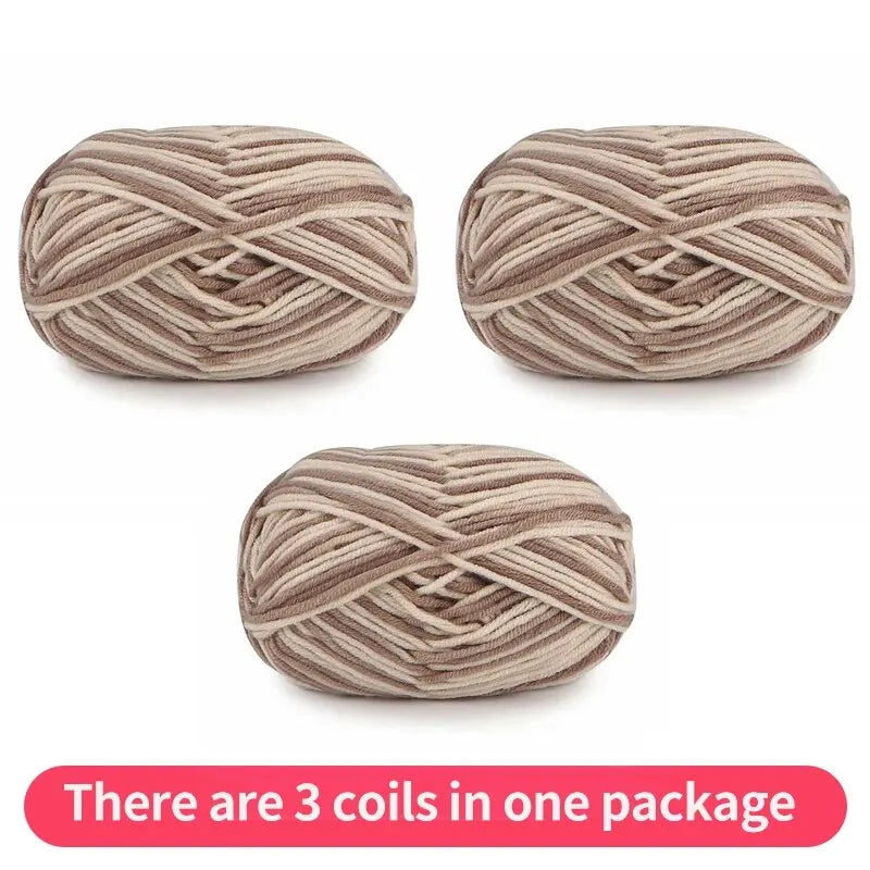 Three beige and taupe variegated yarn skeins, shown as one package.