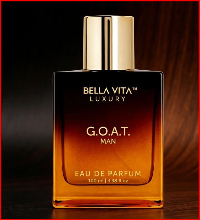 Bella Vita Luxury G.O.A.T. Man Eau de Parfum 100 ml, orange-to-black bottle with gold-tone cap against dark background